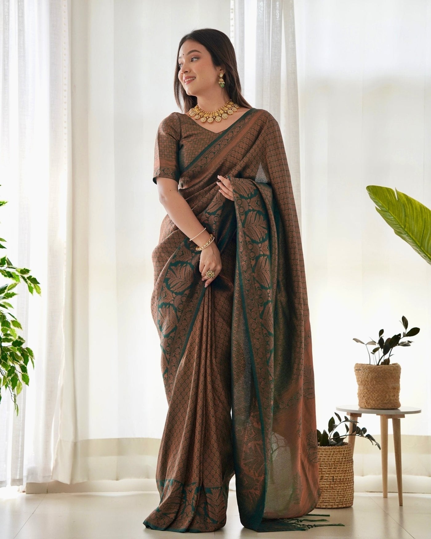 Kuber Pattu Silk Saree, Exuding Regal Charm With Its Rich Pallu And Intricate Brocade Blouse, Elegantly Adorned With Enchanting Tassels On The Saree's Edge. - Almaari Fashion