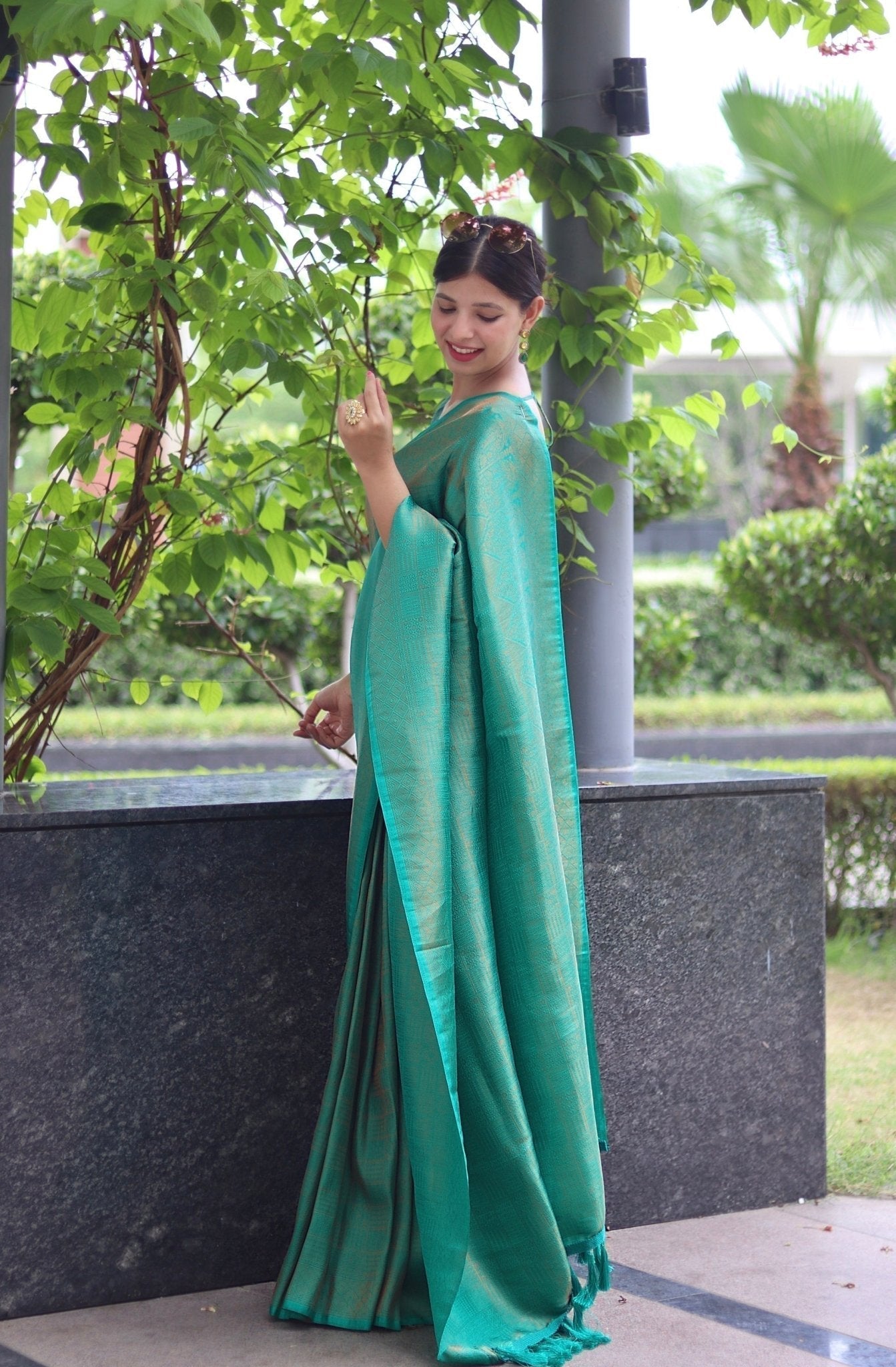 Kuber Pattu Silk Saree, Exuding Regal Charm With Its Rich Pallu And Intricate Brocade Blouse, Elegantly Adorned With Enchanting Tassels On The Saree's Edge. - Almaari Fashion