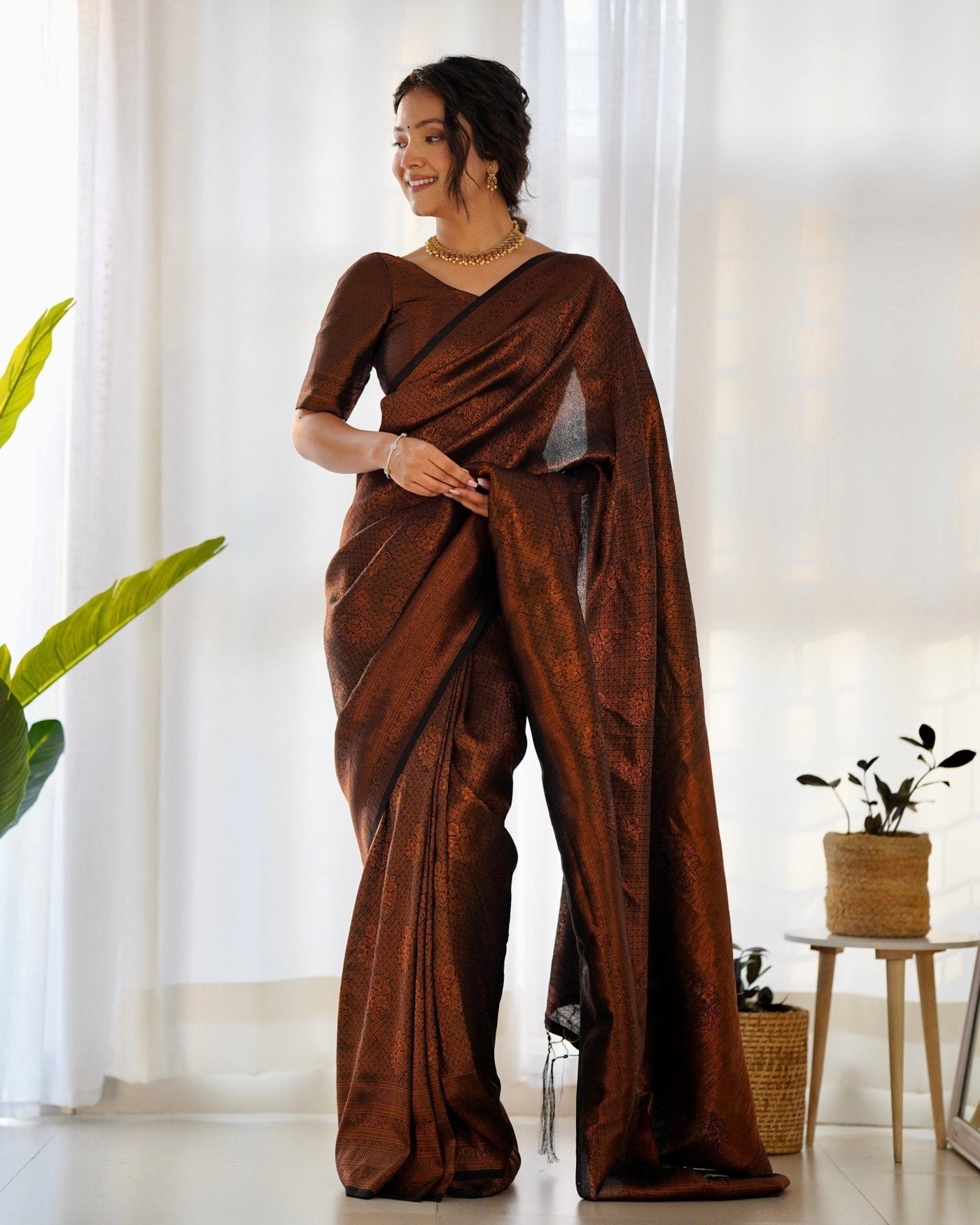 Kuber Pattu Silk Saree, Exuding Regal Charm With Its Rich Pallu And Intricate Brocade Blouse, Elegantly Adorned With Enchanting Tassels On The Saree's Edge. - Almaari Fashion