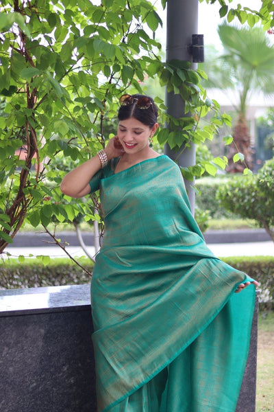 Kuber Pattu Silk Saree, Exuding Regal Charm With Its Rich Pallu And Intricate Brocade Blouse, Elegantly Adorned With Enchanting Tassels On The Saree's Edge. - Almaari Fashion