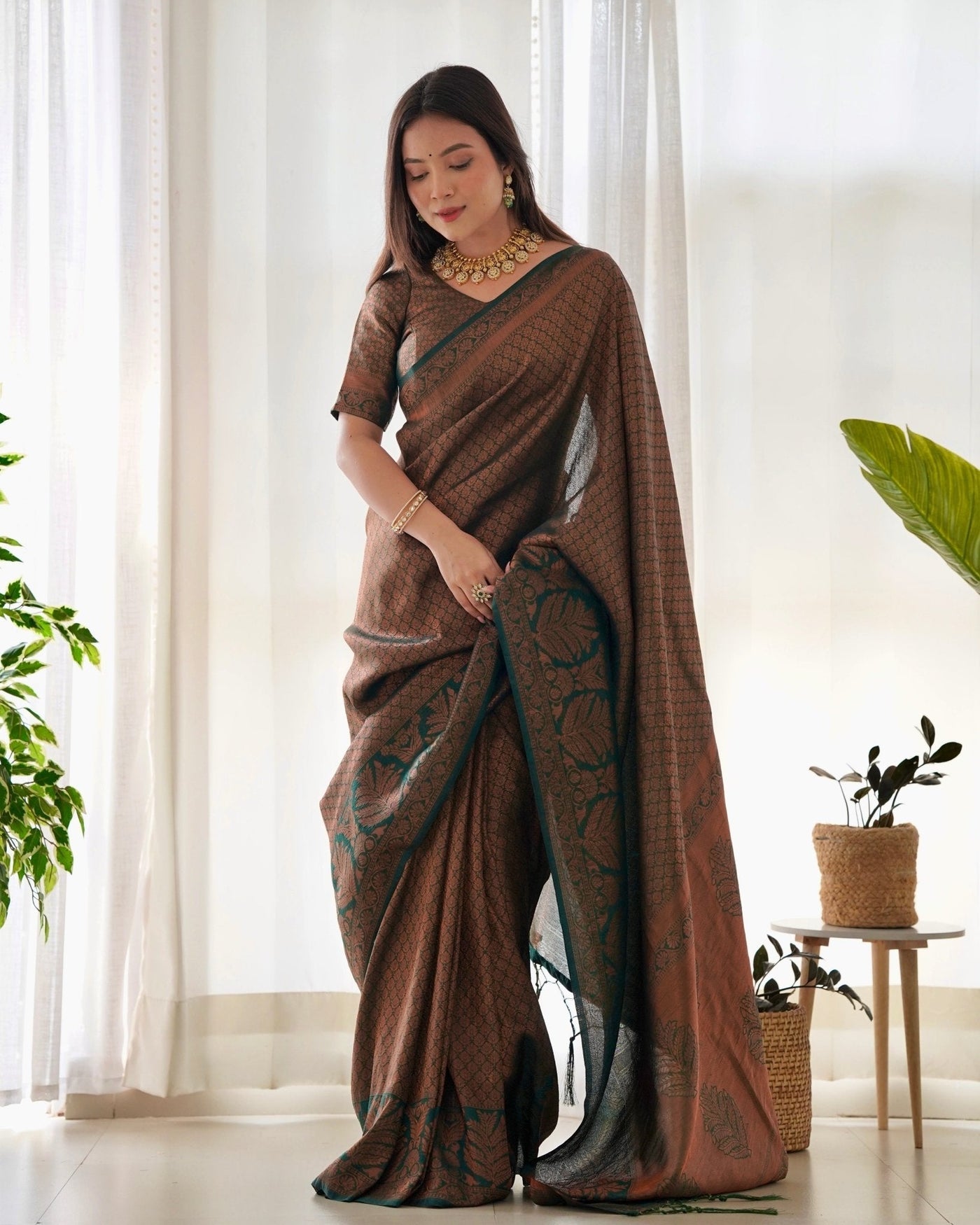 Kuber Pattu Silk Saree, Exuding Regal Charm With Its Rich Pallu And Intricate Brocade Blouse, Elegantly Adorned With Enchanting Tassels On The Saree's Edge. - Almaari Fashion