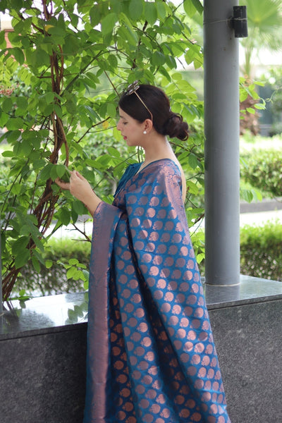 Kuber Pattu Silk Saree, Exuding Regal Charm With Its Rich Pallu And Intricate Brocade Blouse, Elegantly Adorned With Enchanting Tassels On The Saree's Edge. - Almaari Fashion