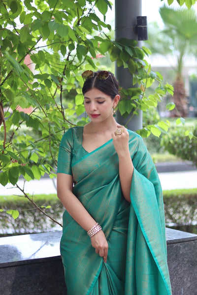 Kuber Pattu Silk Saree, Exuding Regal Charm With Its Rich Pallu And Intricate Brocade Blouse, Elegantly Adorned With Enchanting Tassels On The Saree's Edge. - Almaari Fashion