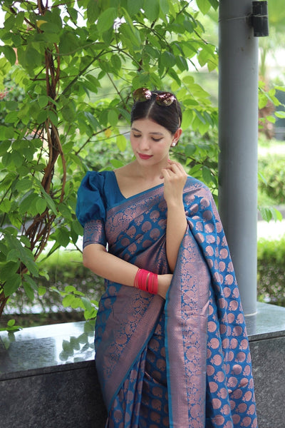 Kuber Pattu Silk Saree, Exuding Regal Charm With Its Rich Pallu And Intricate Brocade Blouse, Elegantly Adorned With Enchanting Tassels On The Saree's Edge. - Almaari Fashion