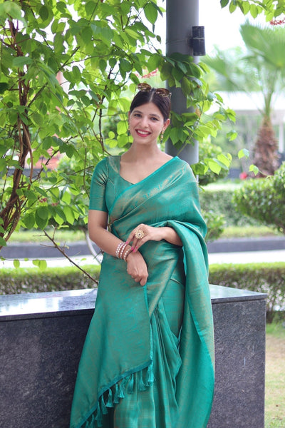 Kuber Pattu Silk Saree, Exuding Regal Charm With Its Rich Pallu And Intricate Brocade Blouse, Elegantly Adorned With Enchanting Tassels On The Saree's Edge. - Almaari Fashion