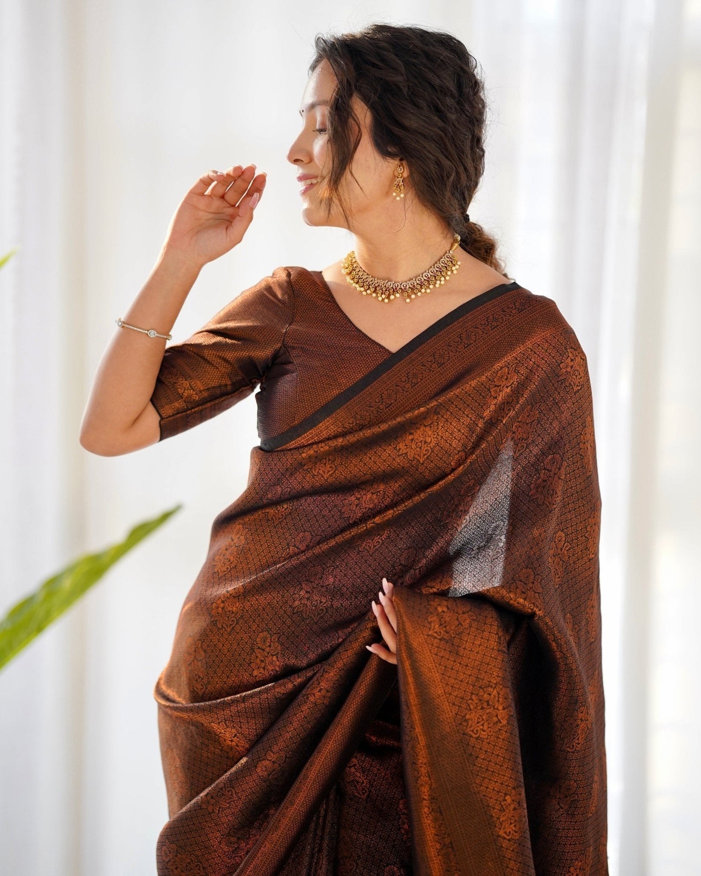 Kuber Pattu Silk Saree, Exuding Regal Charm With Its Rich Pallu And Intricate Brocade Blouse, Elegantly Adorned With Enchanting Tassels On The Saree's Edge. - Almaari Fashion