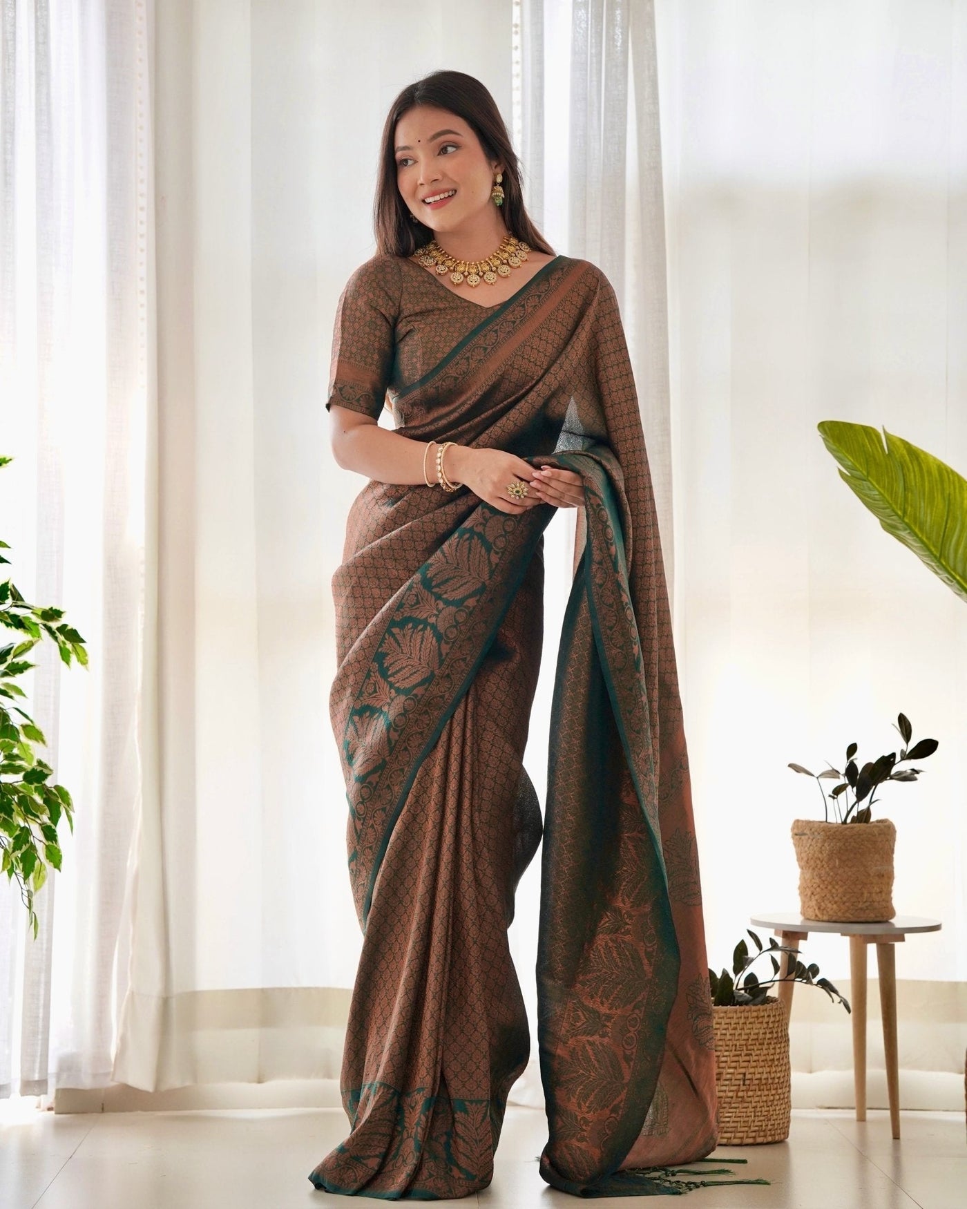 Kuber Pattu Silk Saree, Exuding Regal Charm With Its Rich Pallu And Intricate Brocade Blouse, Elegantly Adorned With Enchanting Tassels On The Saree's Edge. - Almaari Fashion