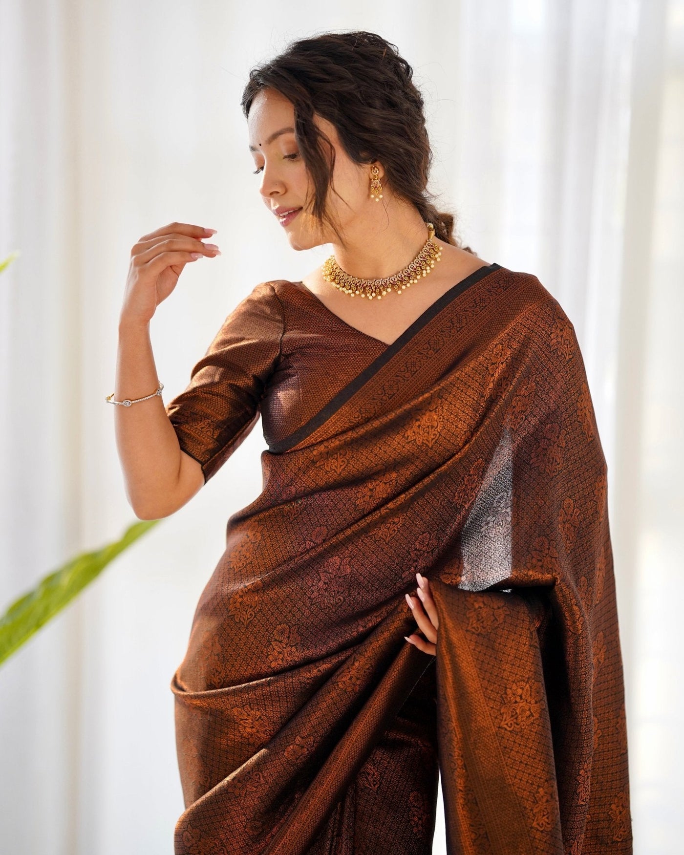 Kuber Pattu Silk Saree, Exuding Regal Charm With Its Rich Pallu And Intricate Brocade Blouse, Elegantly Adorned With Enchanting Tassels On The Saree's Edge. - Almaari Fashion