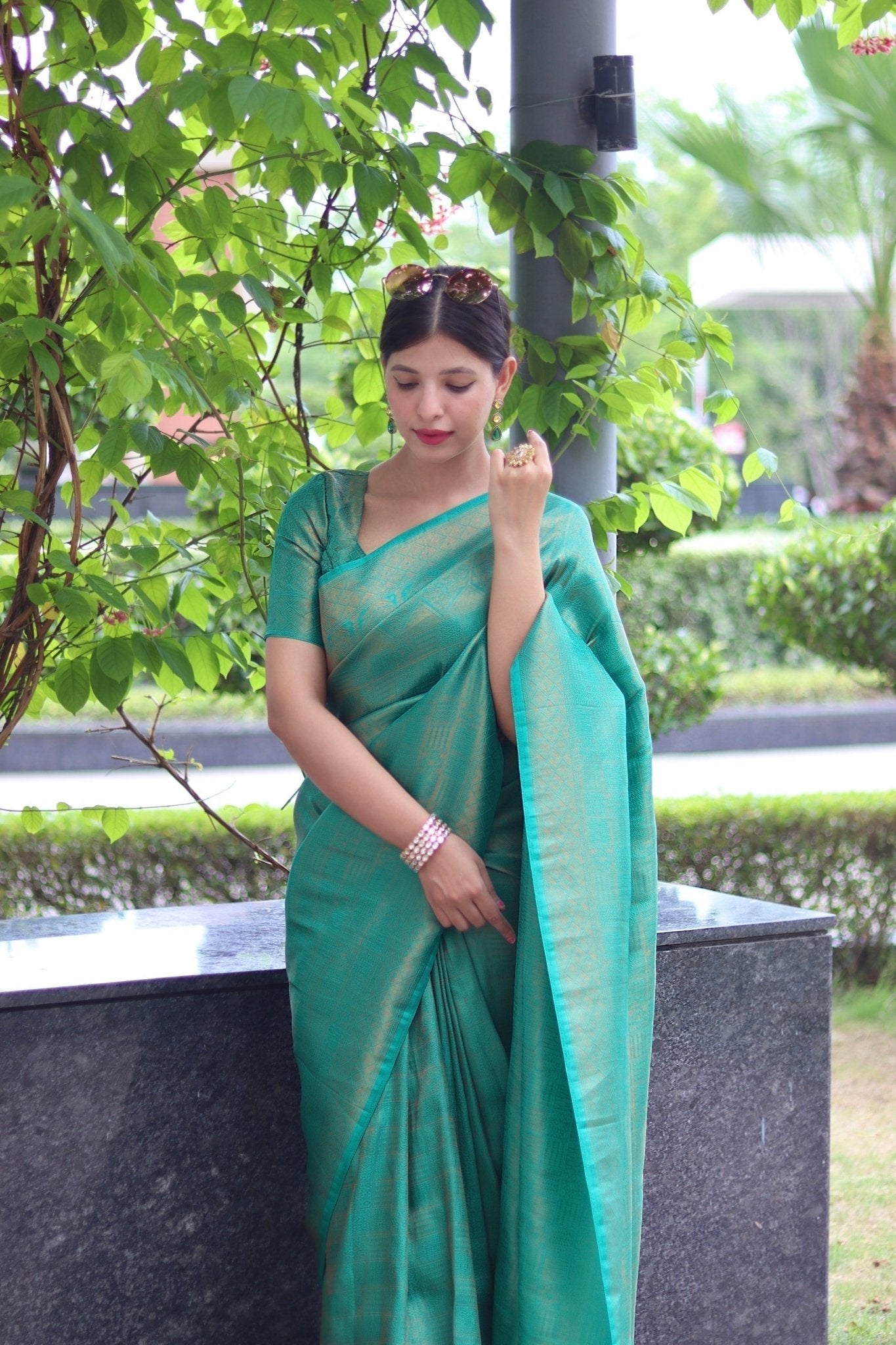 Kuber Pattu Silk Saree, Exuding Regal Charm With Its Rich Pallu And Intricate Brocade Blouse, Elegantly Adorned With Enchanting Tassels On The Saree's Edge. - Almaari Fashion