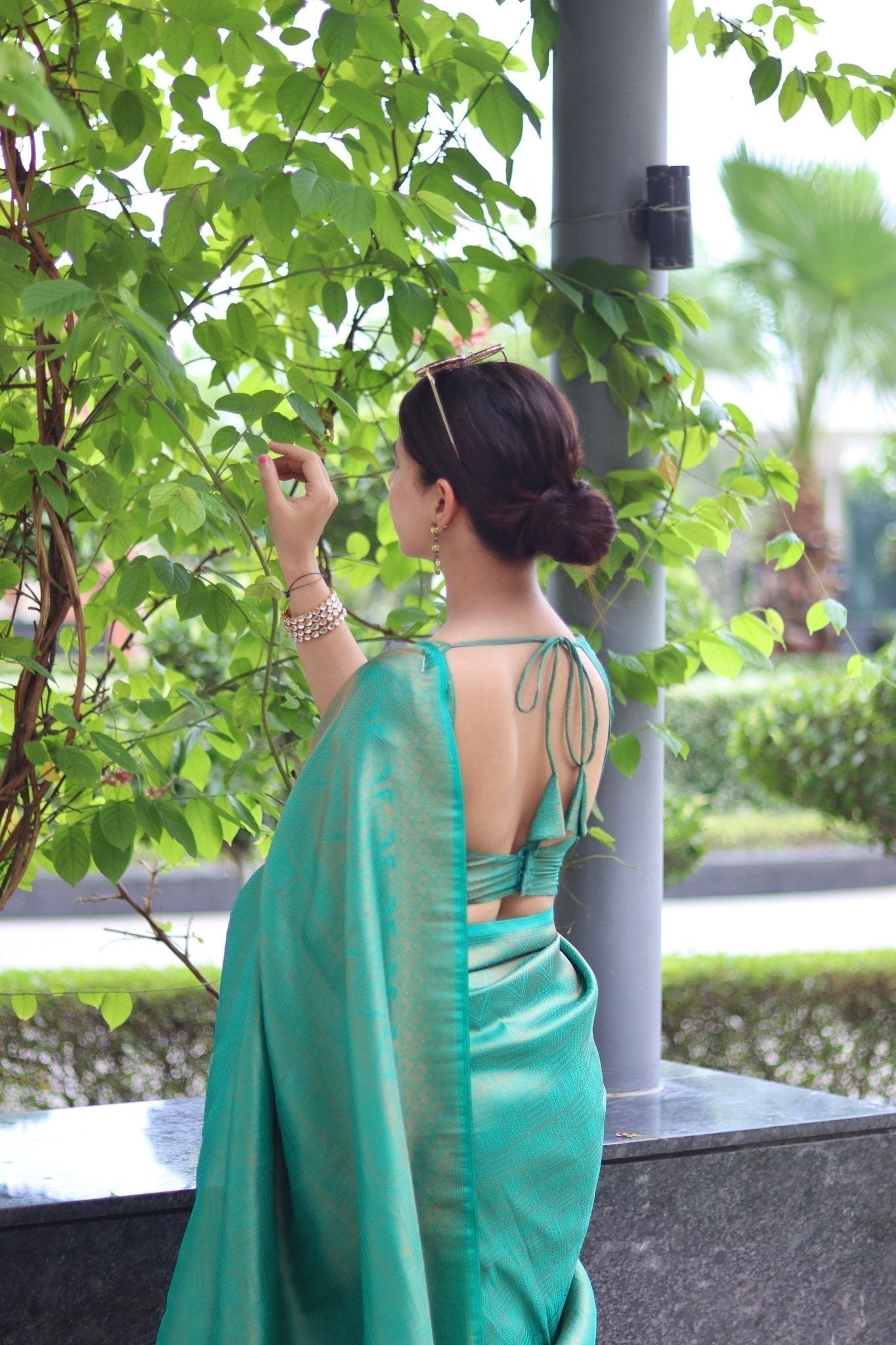 Kuber Pattu Silk Saree, Exuding Regal Charm With Its Rich Pallu And Intricate Brocade Blouse, Elegantly Adorned With Enchanting Tassels On The Saree's Edge. - Almaari Fashion