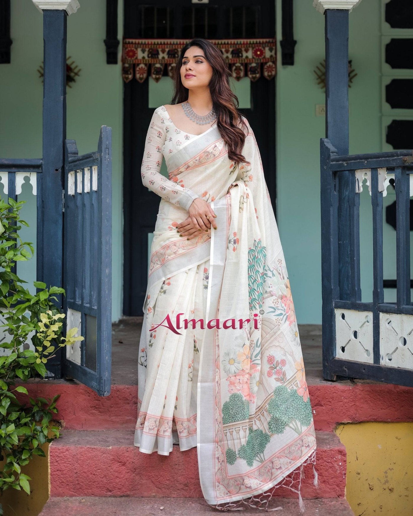 Ivory Pure Cotton Linen Saree with Pastel Floral Design, Blouse, and Tassel Detailing