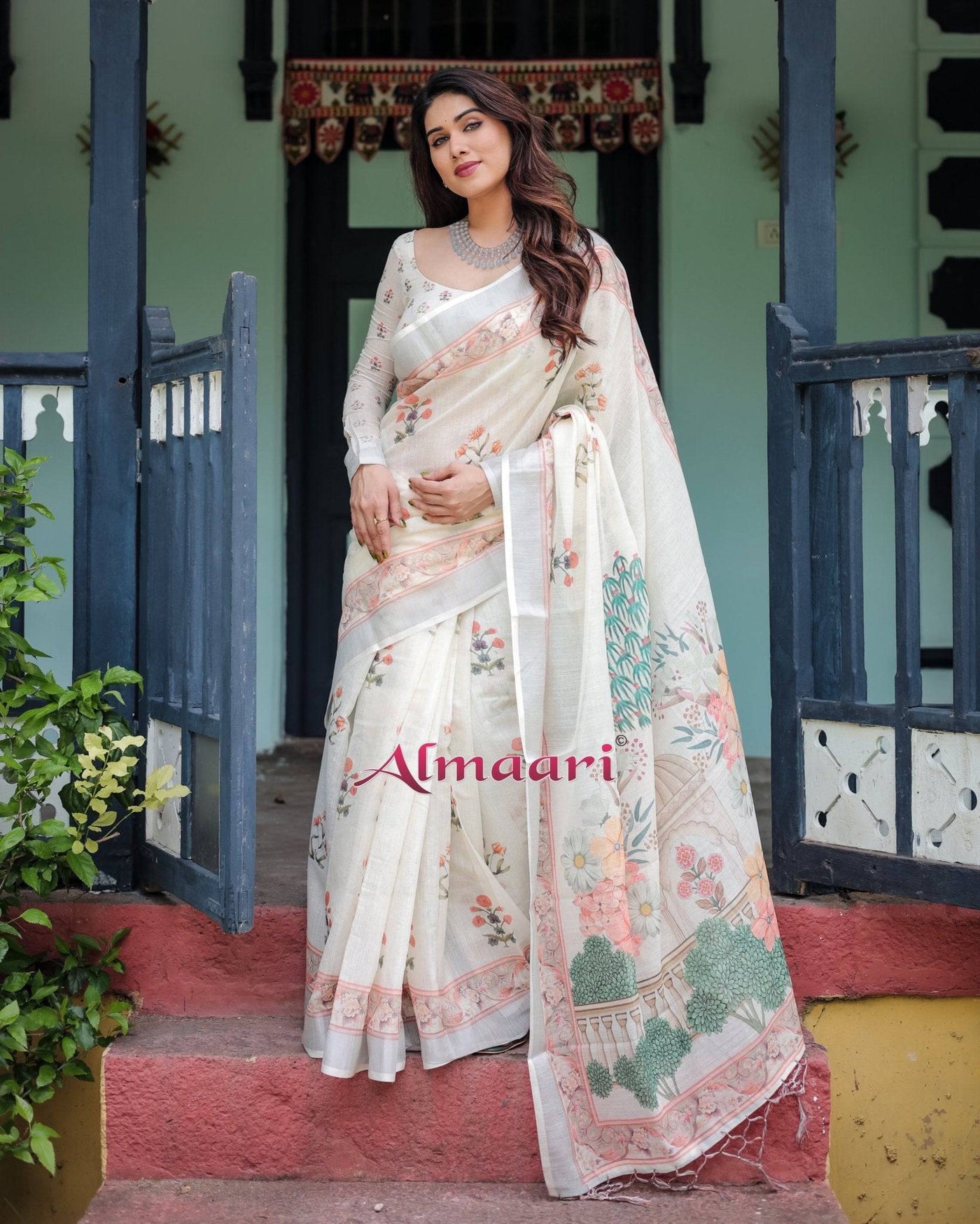 Ivory Pure Cotton Linen Saree with Pastel Floral Design, Blouse, and Tassel Detailing