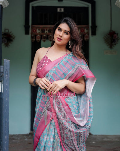 Aqua Blue Pure Cotton Linen Saree with Pink Border, Floral Motifs, and Tassel Detailing