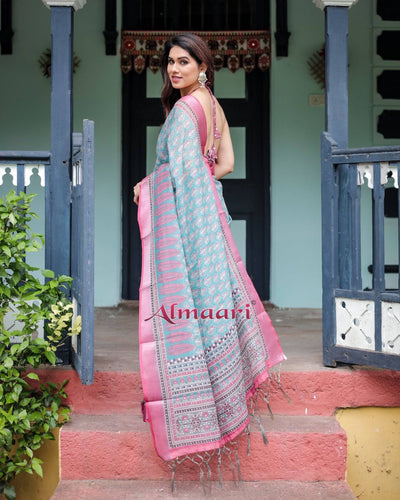 Aqua Blue Pure Cotton Linen Saree with Pink Border, Floral Motifs, and Tassel Detailing