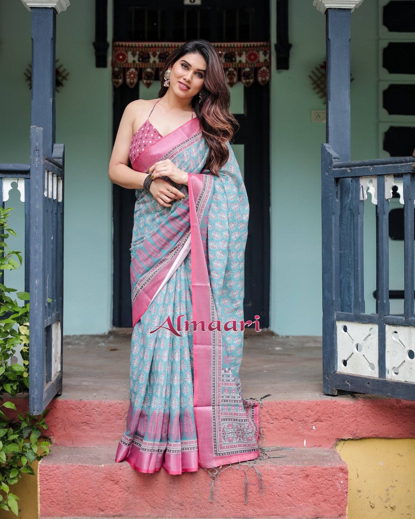 Aqua Blue Pure Cotton Linen Saree with Pink Border, Floral Motifs, and Tassel Detailing