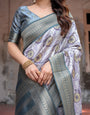 Sophisticated Lilac Banarasi Silk Saree with Floral Prints and Zari Tassel Border