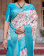 White and Aqua Floral Design Banarasi Silk Saree with Zari Weave and Tassel-Embellished Pallu