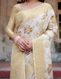 Ivory and Gold Banarasi Silk Saree with Floral Print, Zari Border, and Tassels