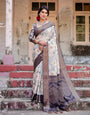 Elegant Gray Banarasi Silk Saree with Navy Blue Zari Weave, Floral Design, and Tassels