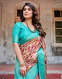 Maroon and Teal Paisley Design Banarasi Silk Saree with Zari Weave and Tassel-Embellished Pallu