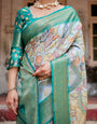 Graceful Green Banarasi Silk Saree with Vibrant Motifs and Zari Woven Pallu