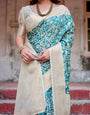 Teal and Cream Floral Banarasi Silk Saree with Zari Weave and Tassel-Accented Pallu