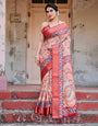 Beige and Coral Tussar Silk Saree with Intricate Floral Prints and Artistic Pallu