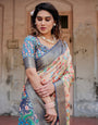 Peach and Navy Blue Floral Saree with Vibrant Peacock Pallu and Tassel Detailing