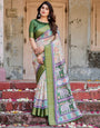 Ivory and Green Tussar Silk Saree with Elephant Motifs and Intricate Zari Border