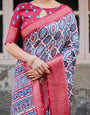 White and Red Tussar Silk Saree with Vibrant Floral Geometric Motifs and Ornamental Zari Border