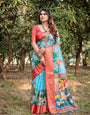 Aqua Blue Tussar Silk Saree with Vibrant Nature-Inspired Prints and Red Zari Border