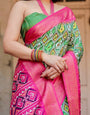 Green and Pink Banarasi Silk Saree with Vibrant Ikat Patterns and Zari Border