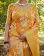 Sunshine Yellow Banarasi Silk Saree with White Floral Motifs, Lustrous Zari Border, and Graceful Tassel Pallu