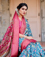 Teal Blue and Coral Tussar Silk Saree with Vibrant Floral Motifs and Ornamental Pallu